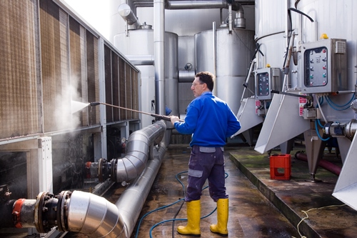 Hot water pressure washer in use 